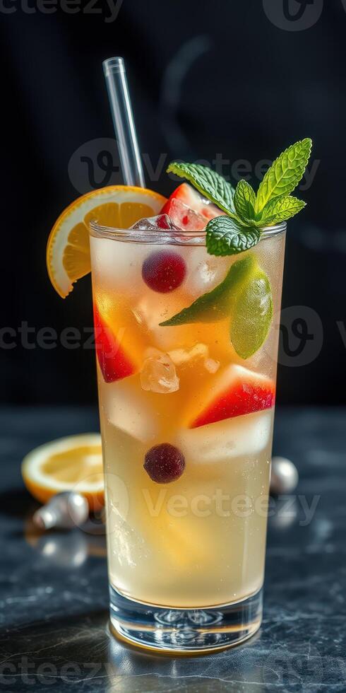 Refreshing summer cocktail with fresh fruits and mint on a dark background photo