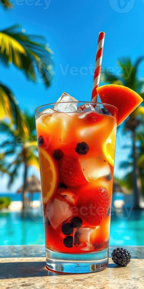 Refreshing tropical drink with fresh fruits by a sunny poolside photo