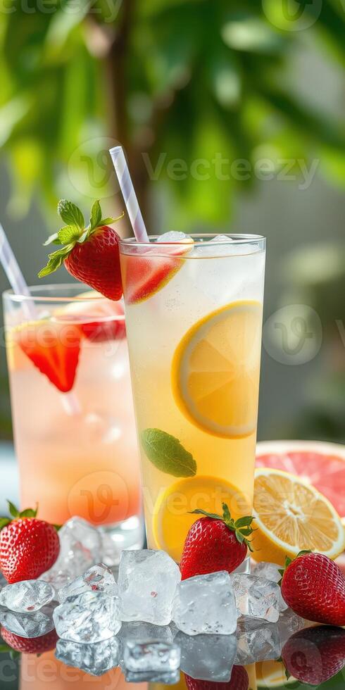 Refreshing summer cocktails with fresh strawberries and citrus fruits served over ice photo