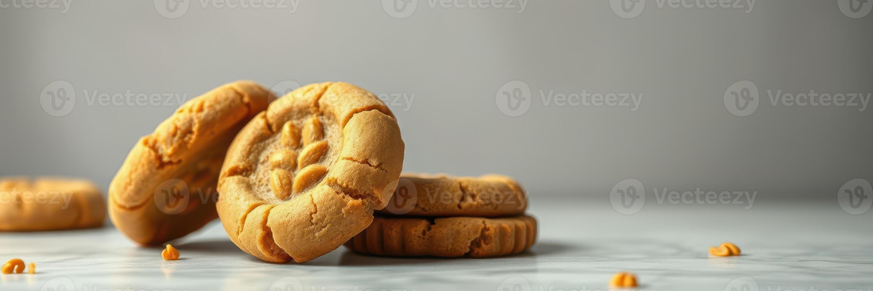 Delicious homemade peanut butter cookies stacked on a marble countertop in a cozy kitchen setting photo