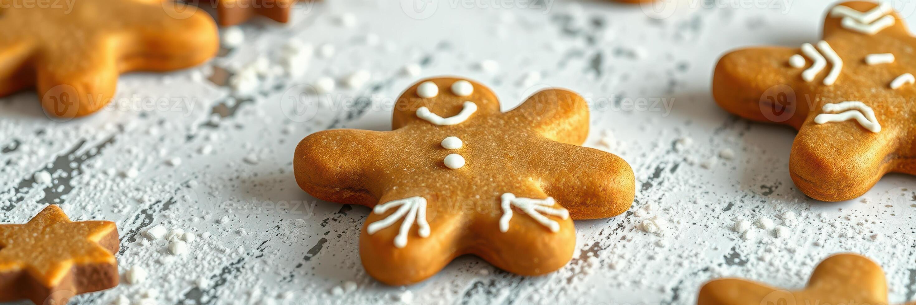 Decorated gingerbread cookies arranged on a rustic wooden table ready for holiday festivities photo