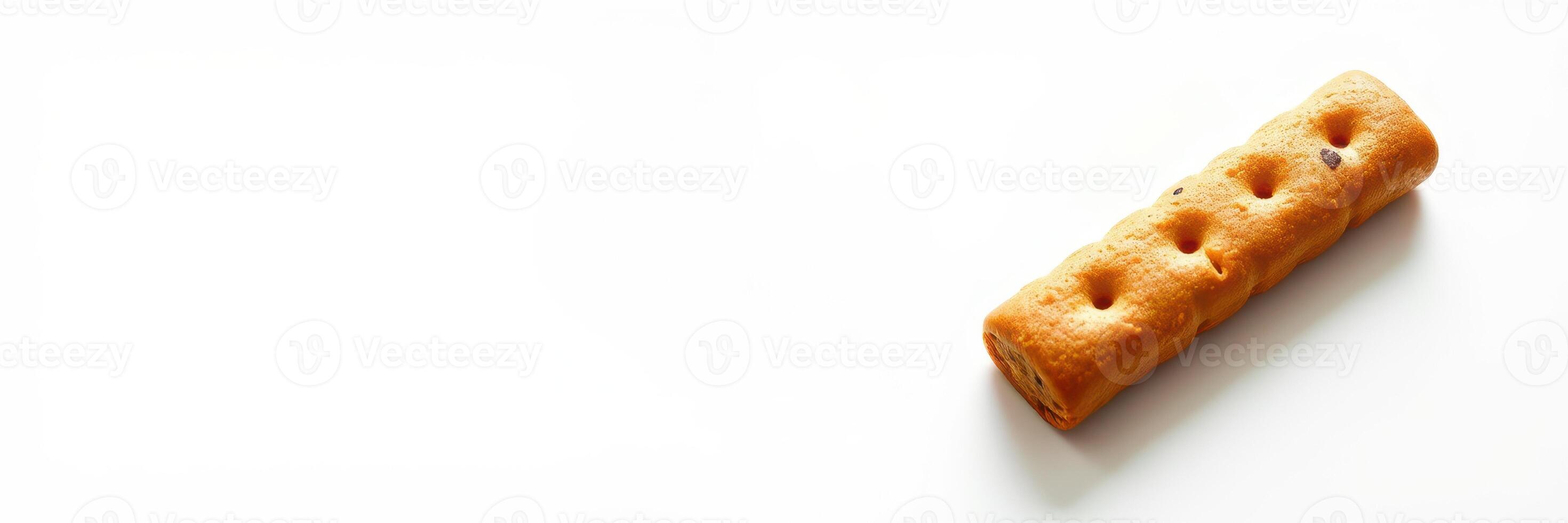 Sweet cookie stick on a white background with chocolate chips and a crispy texture perfect for snacking photo