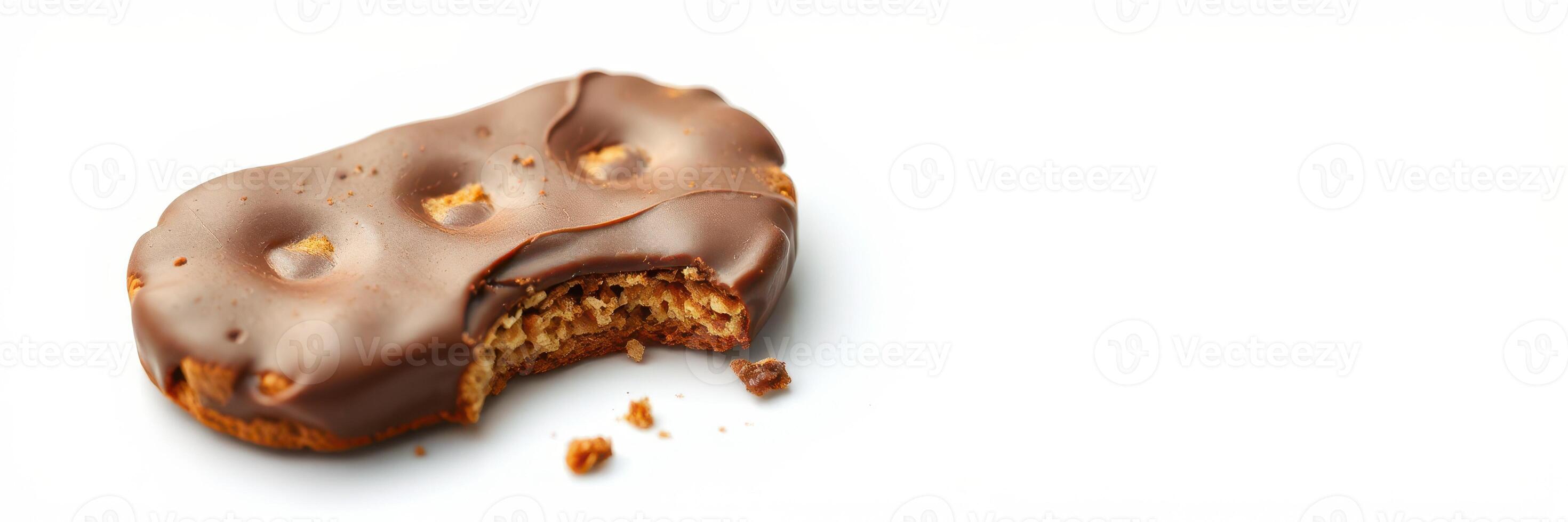 Chocolate-coated biscuit with a bite taken out, showcasing its texture and crumbs on a plain background photo