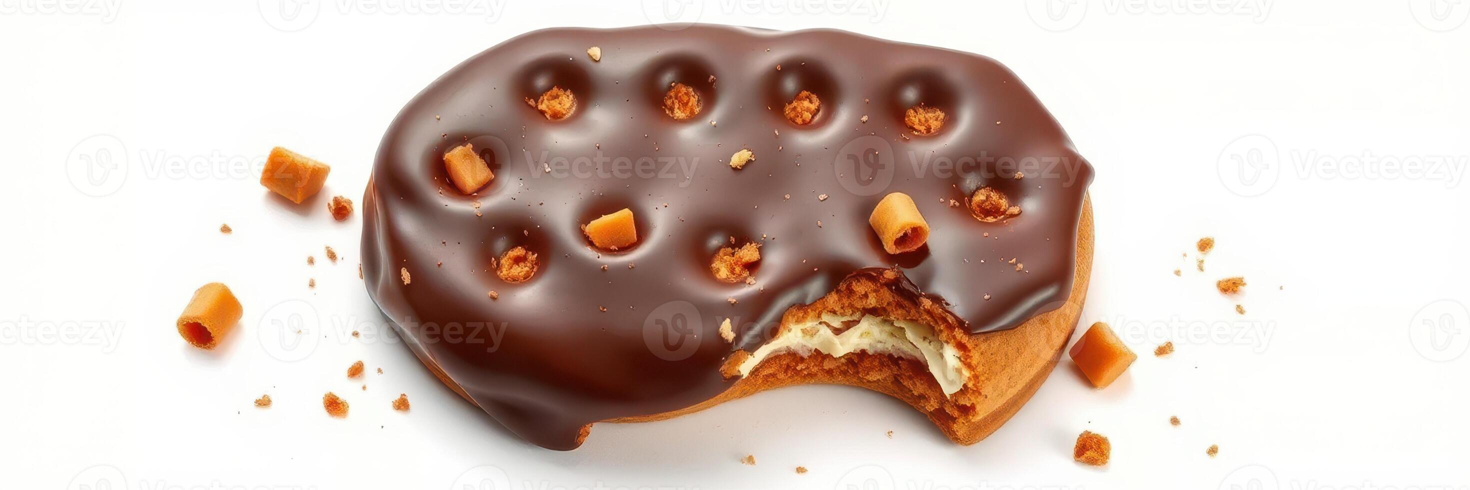 Delicious chocolate-covered cookie with caramel bits and a bite taken out, showcasing its creamy filling photo