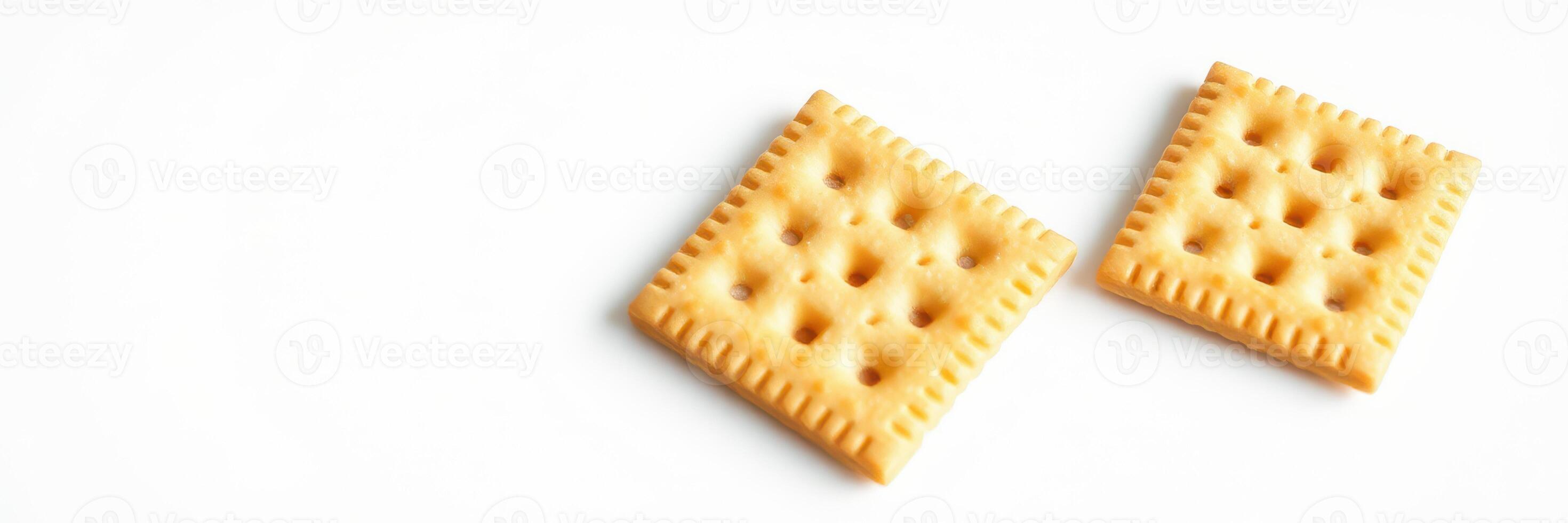 Crisp and savory crackers placed on a clean white surface ready for snacking or pairing with toppings photo