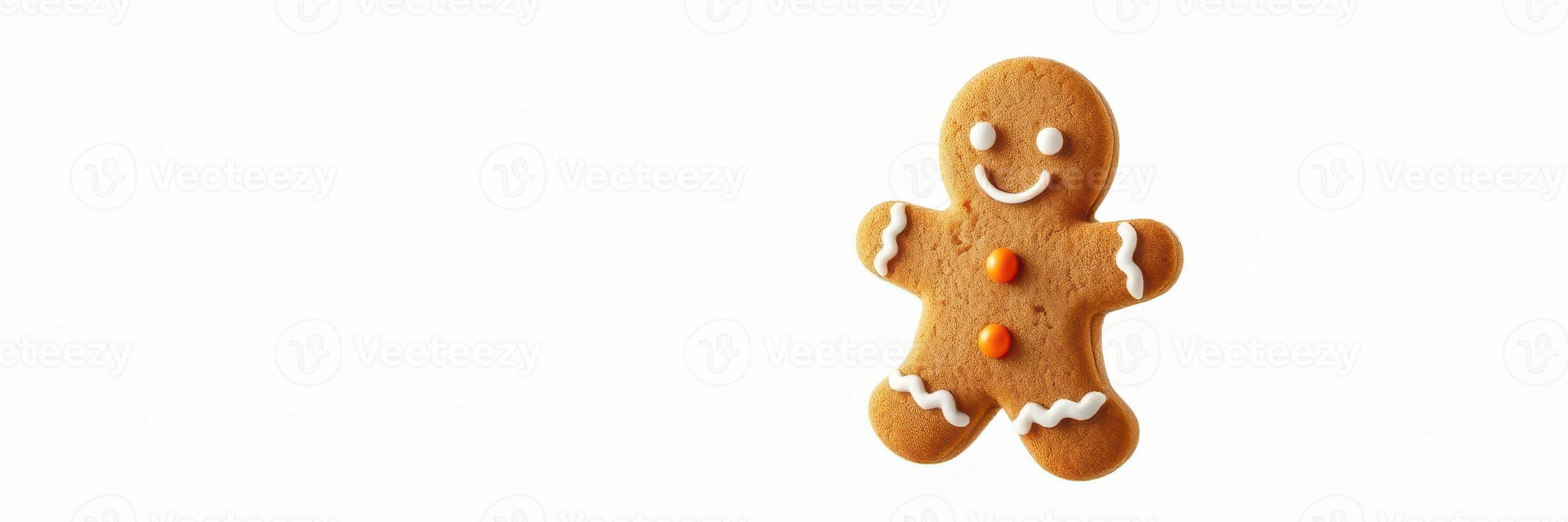 Gingerbread cookie with a smiling face and decorative frosting, perfect for festive occasions photo