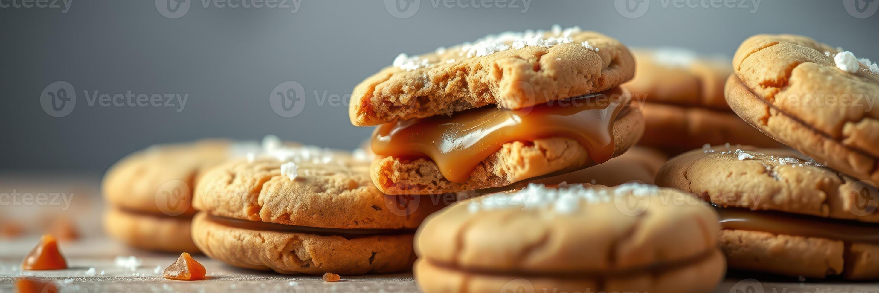 Delicious homemade caramel-filled cookies with sea salt on a rustic wooden surface photo