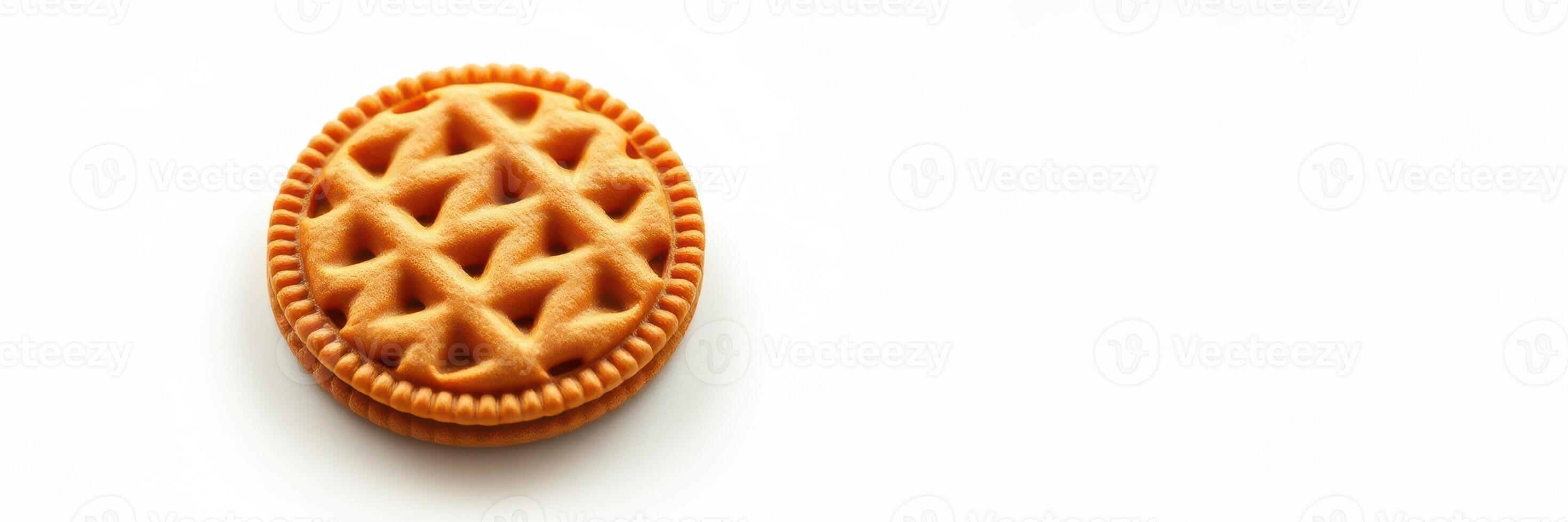 Delicious round cookie with waffle pattern sits on a white background photo