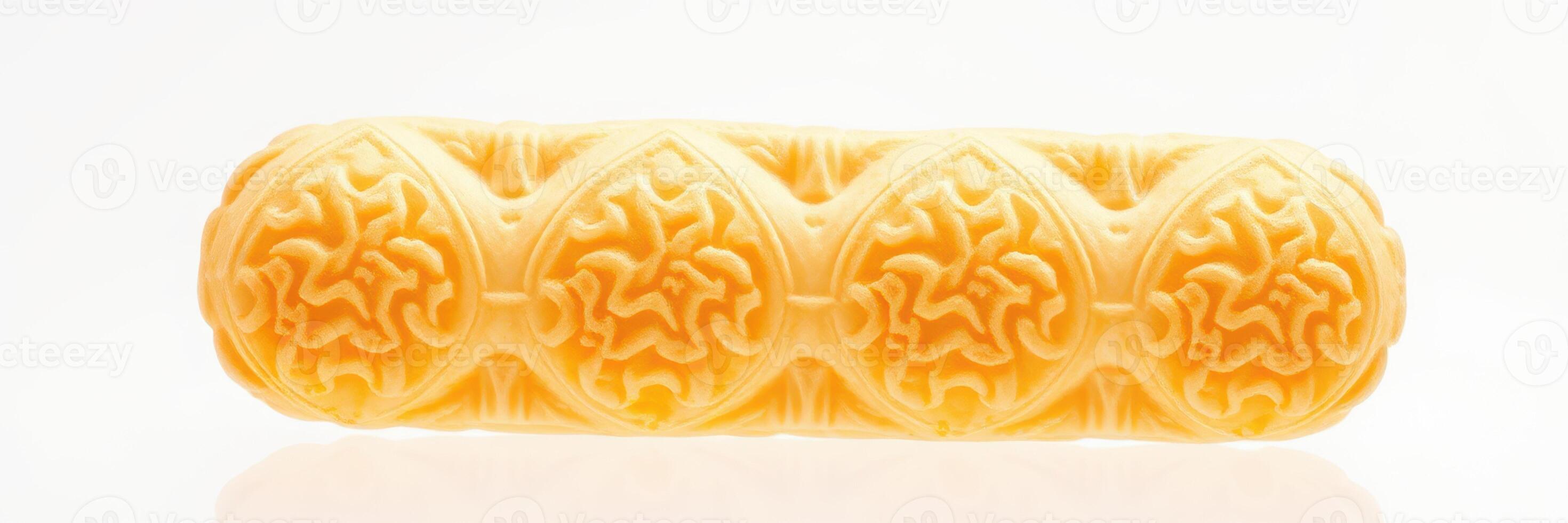 Ornate yellow decorative object showcasing intricate design patterns and textures against a neutral background photo