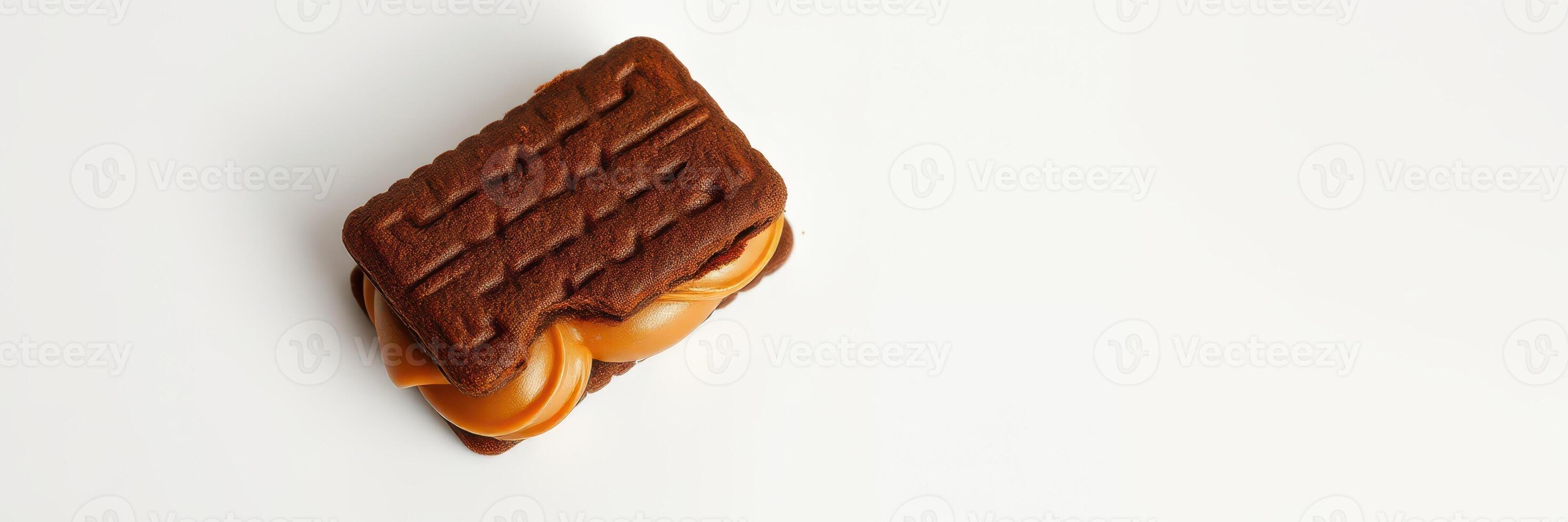 Delicious chocolate cookie filled with rich caramel served on a clean surface photo