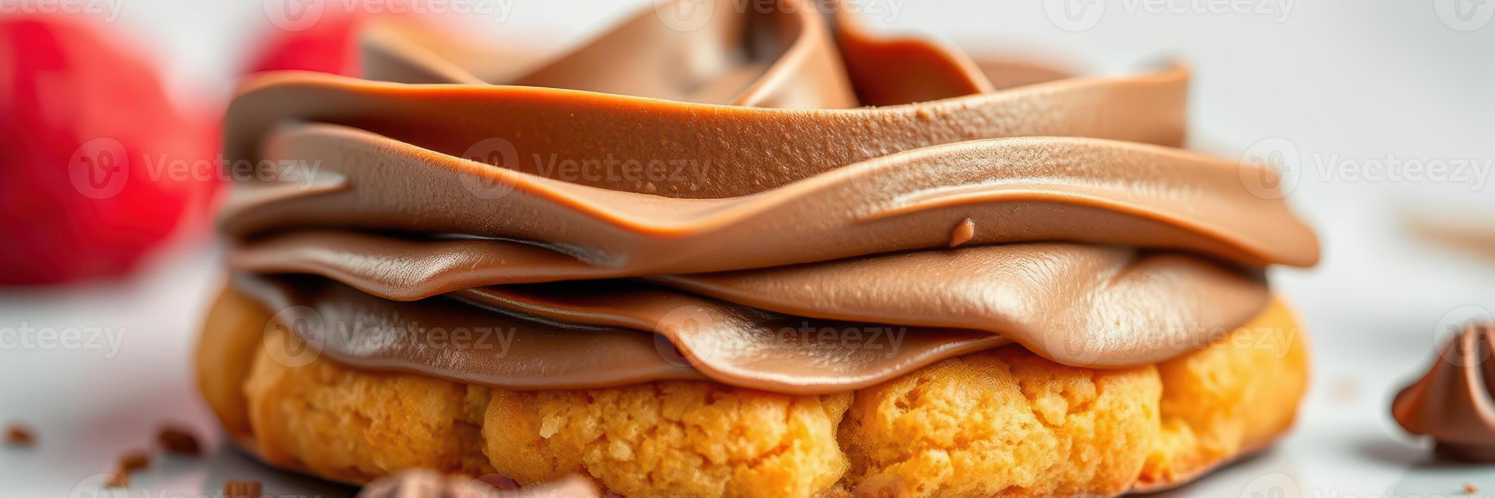 Delicious chocolate frosting on a freshly baked cookie topped with cocoa accents and fruit photo