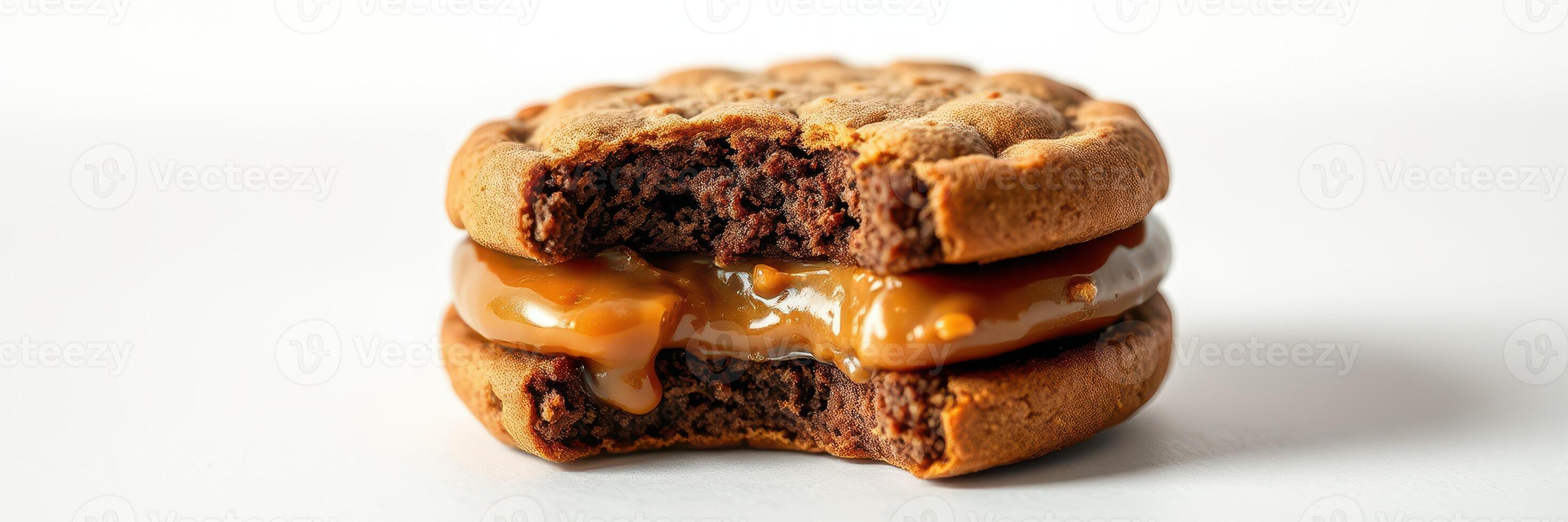 Delicious dessert sandwich made of chocolate cookies and sweet caramel filling photo