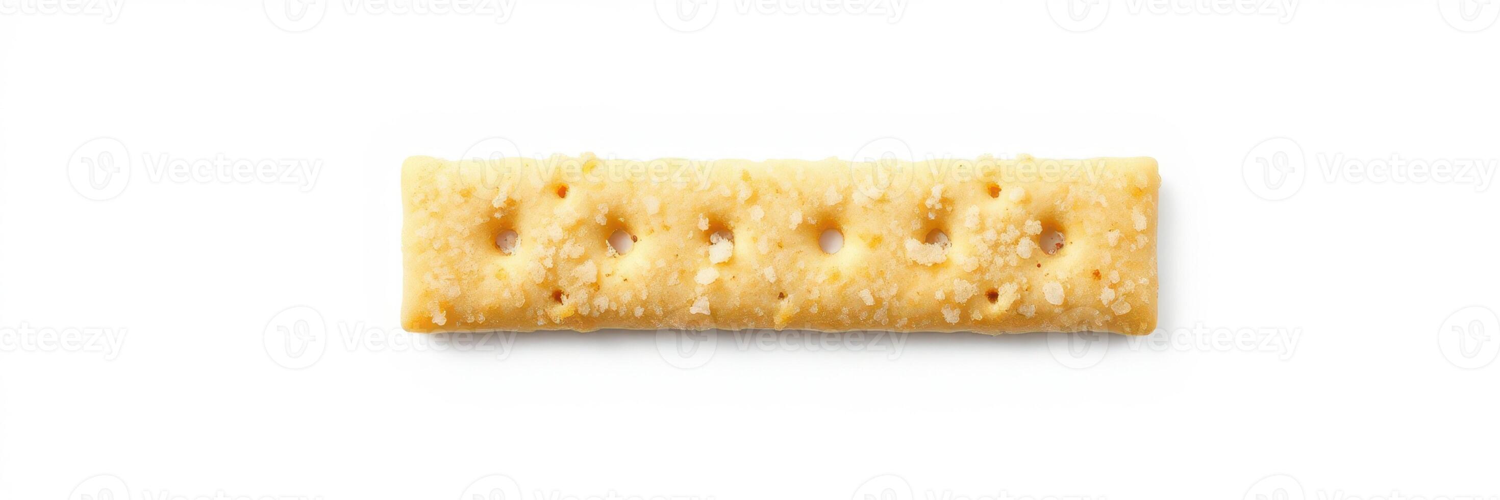 Long rectangular cracker placed on a white background, highlighting its texture and shape in a minimalist presentation photo