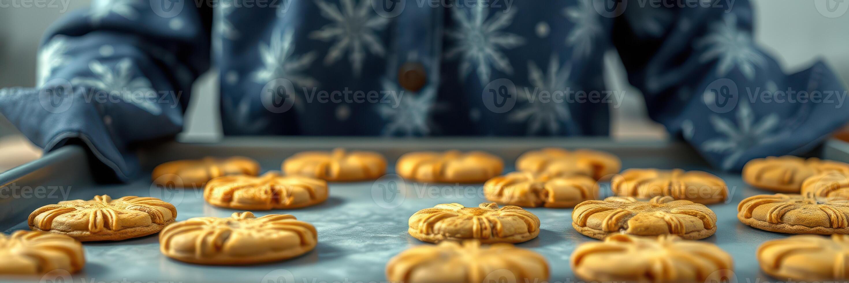 Cookies baked during a festive season with intricate designs on a tray prepared in a cozy kitchen setting photo