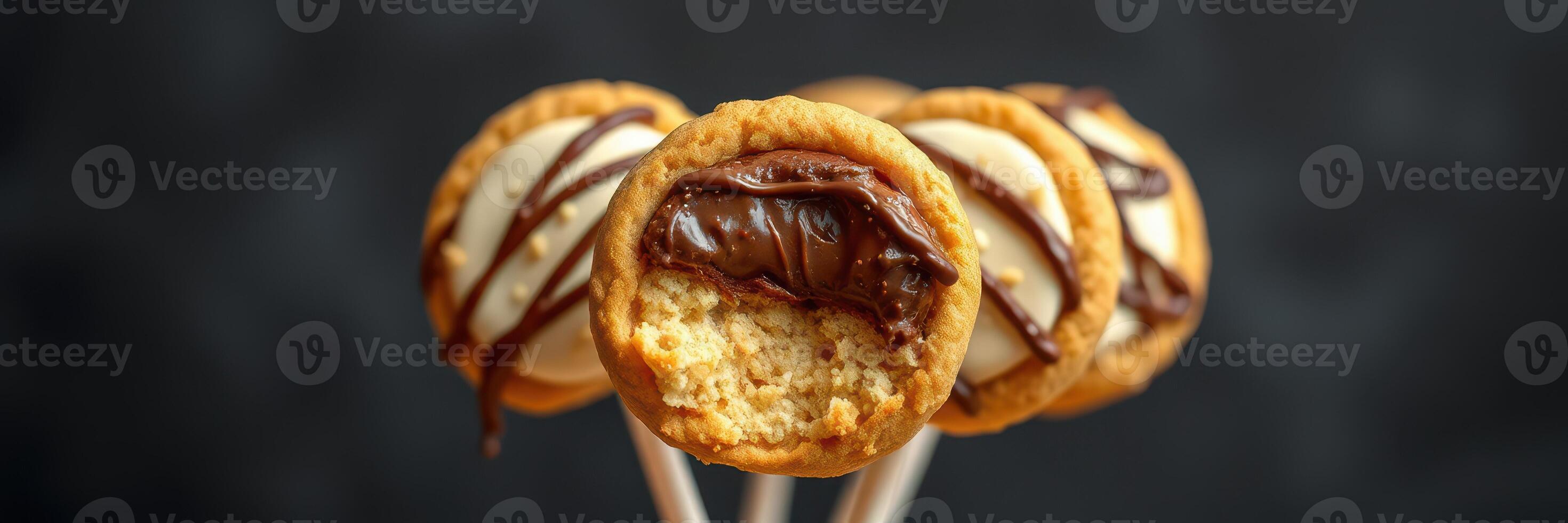 Delicious cookies filled with chocolate and topped with creamy frosting prepared for a sweet treat photo