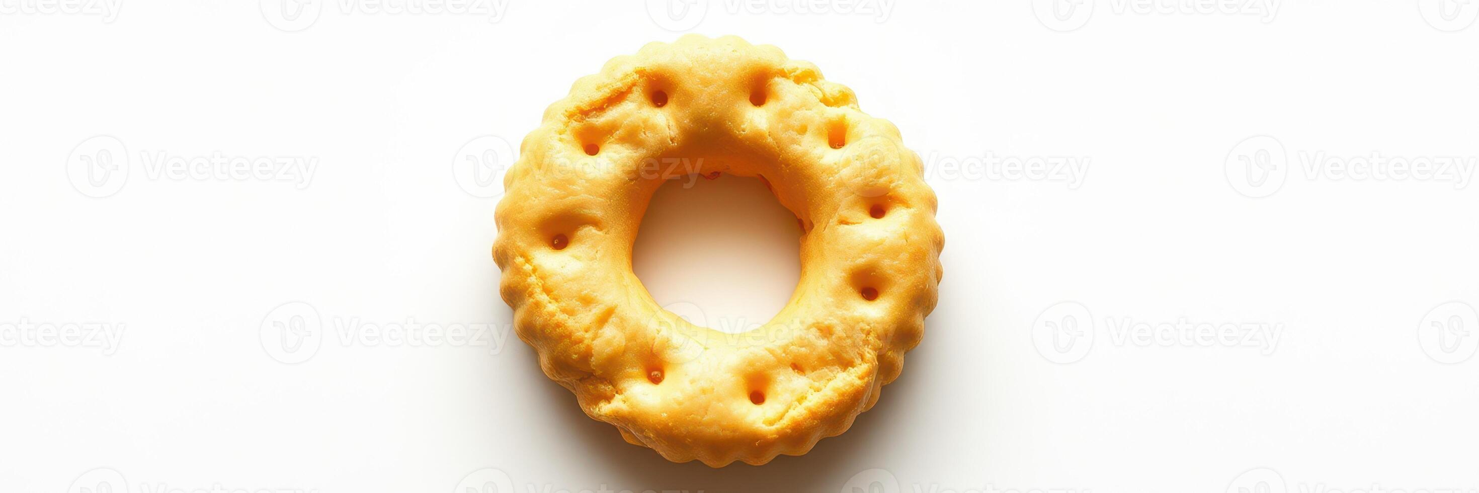 Unique circular snack resembling a cheese puff resting on a plain background photo