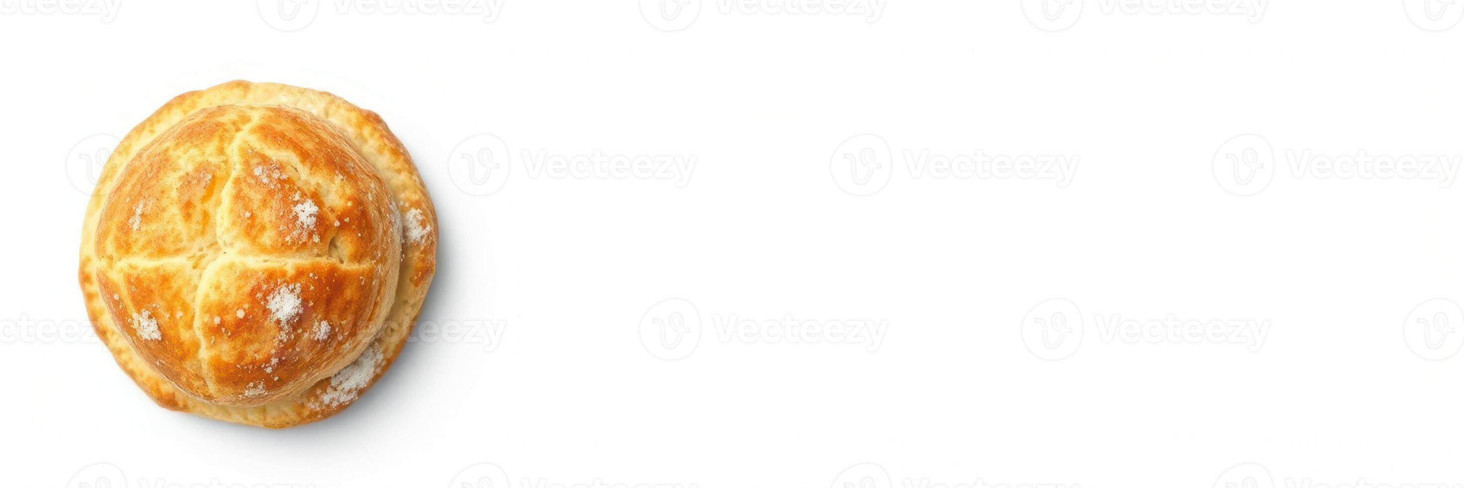 Freshly baked pastry resting on a clean white surface ready to be enjoyed with coffee or tea photo