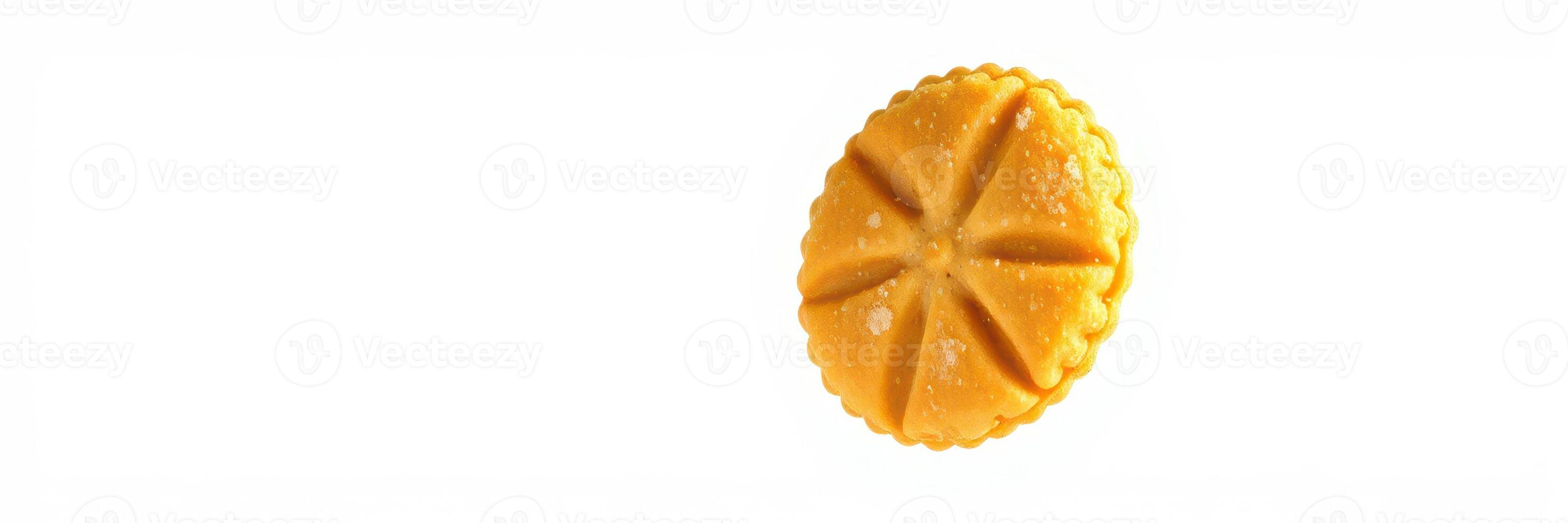 Delicious round pastry with a shiny glaze resting on a clean surface photo