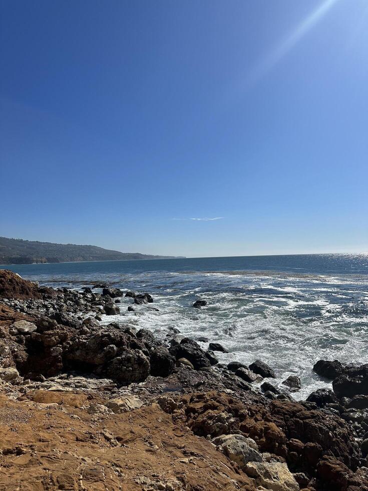 Waves crashing on shore photo