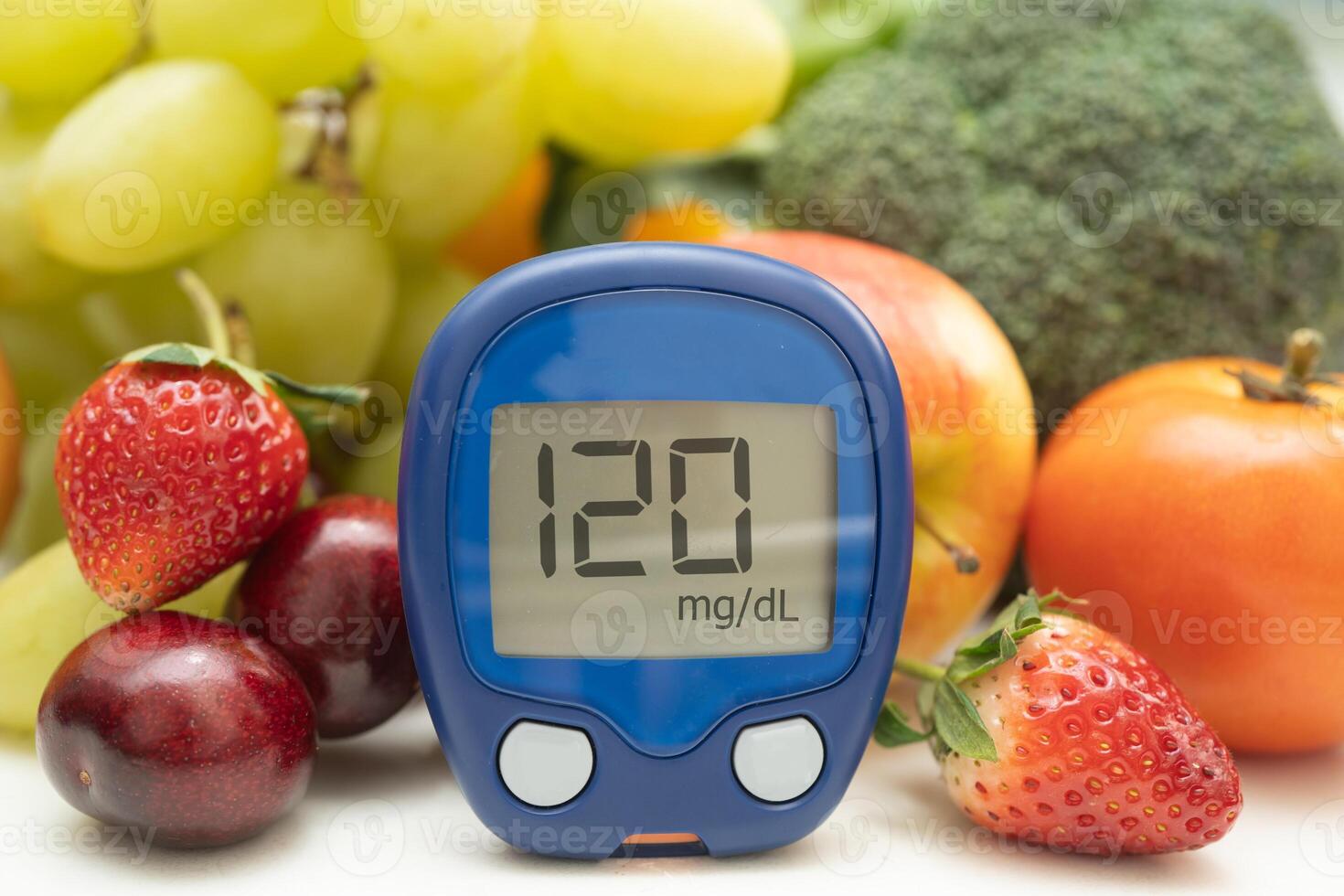 Glucose meter with vegetable and fruit for check sample blood sugar level to treatment diabetes. photo