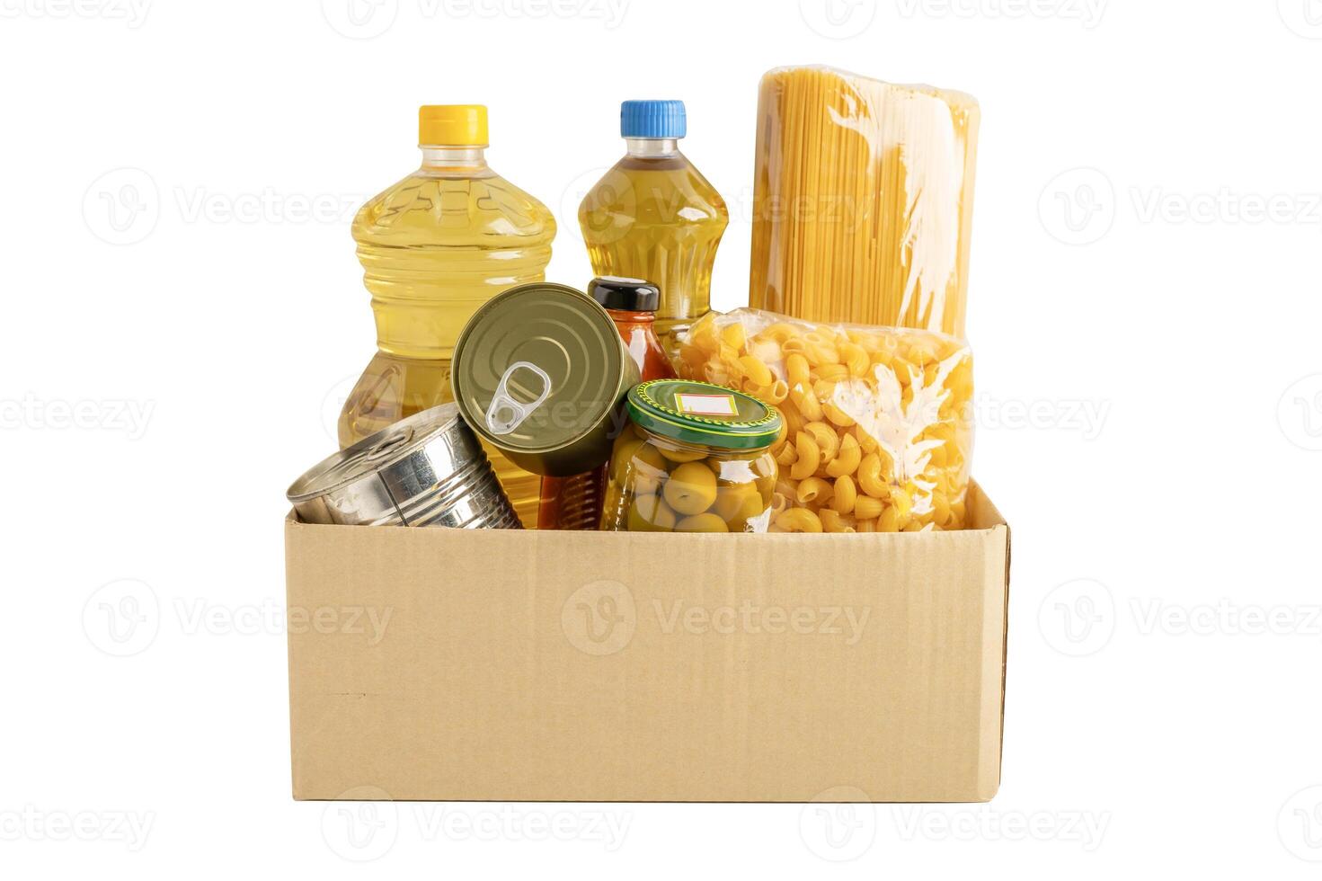 Foodstuffs in donation box isolated on white background with clipping path for volunteer to help people. photo