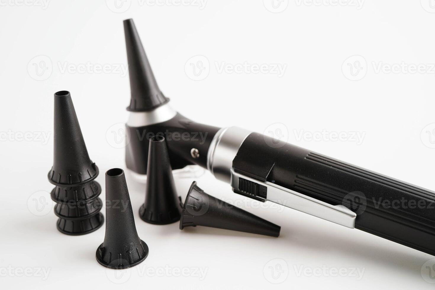 Otoscope isolated on white background for otolaryngologist or ENT physician doctor examining senior patient ear, hearing loss problem. photo