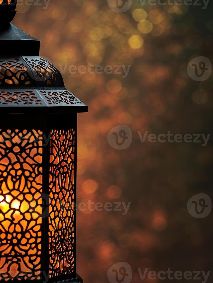 Elegant middle eastern lantern with intricate patterns illuminated at night photo