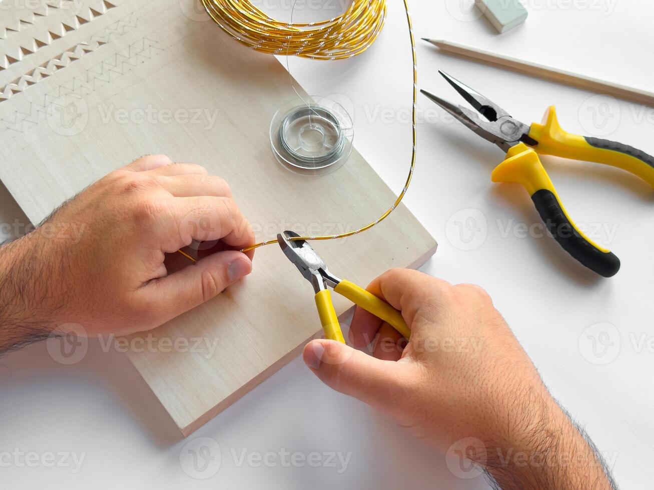 Crafting with precision. Hand tools and wire for diy projects photo