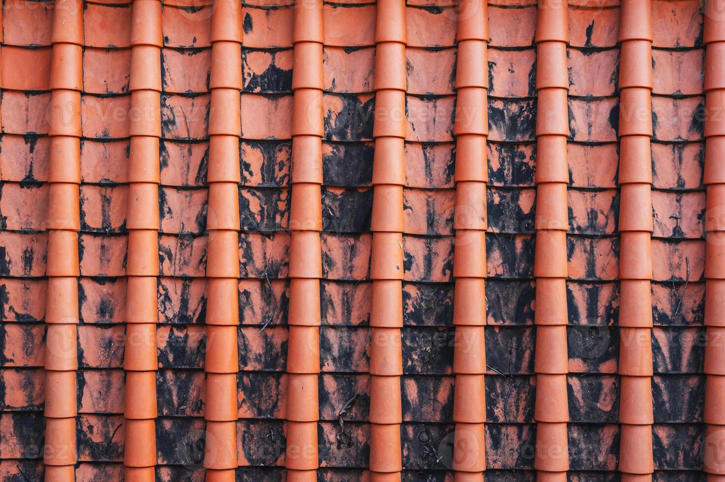 A close-up image of the traditional tile roof pattern of an old Buddhist temple. Texture for the background photo