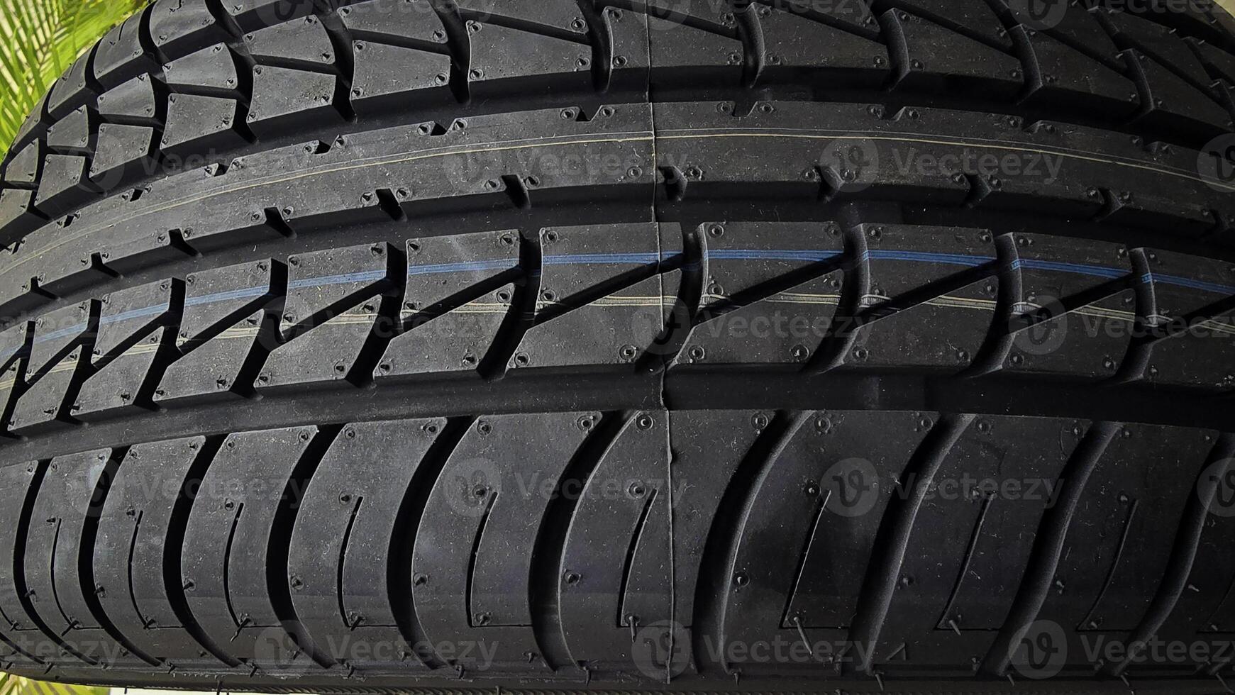 Close-Up View of a Car Tire with Modern Tread Design photo