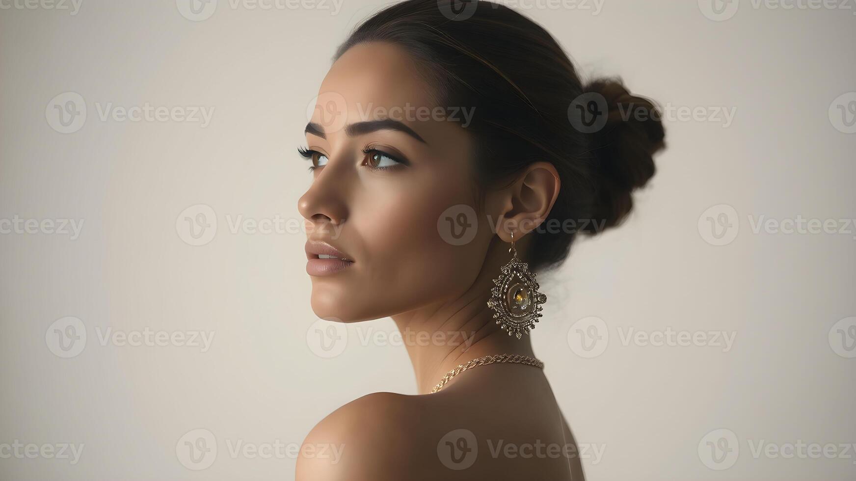 Elegant side profile of a woman showcasing a luminous complexion against a neutral backdrop photo