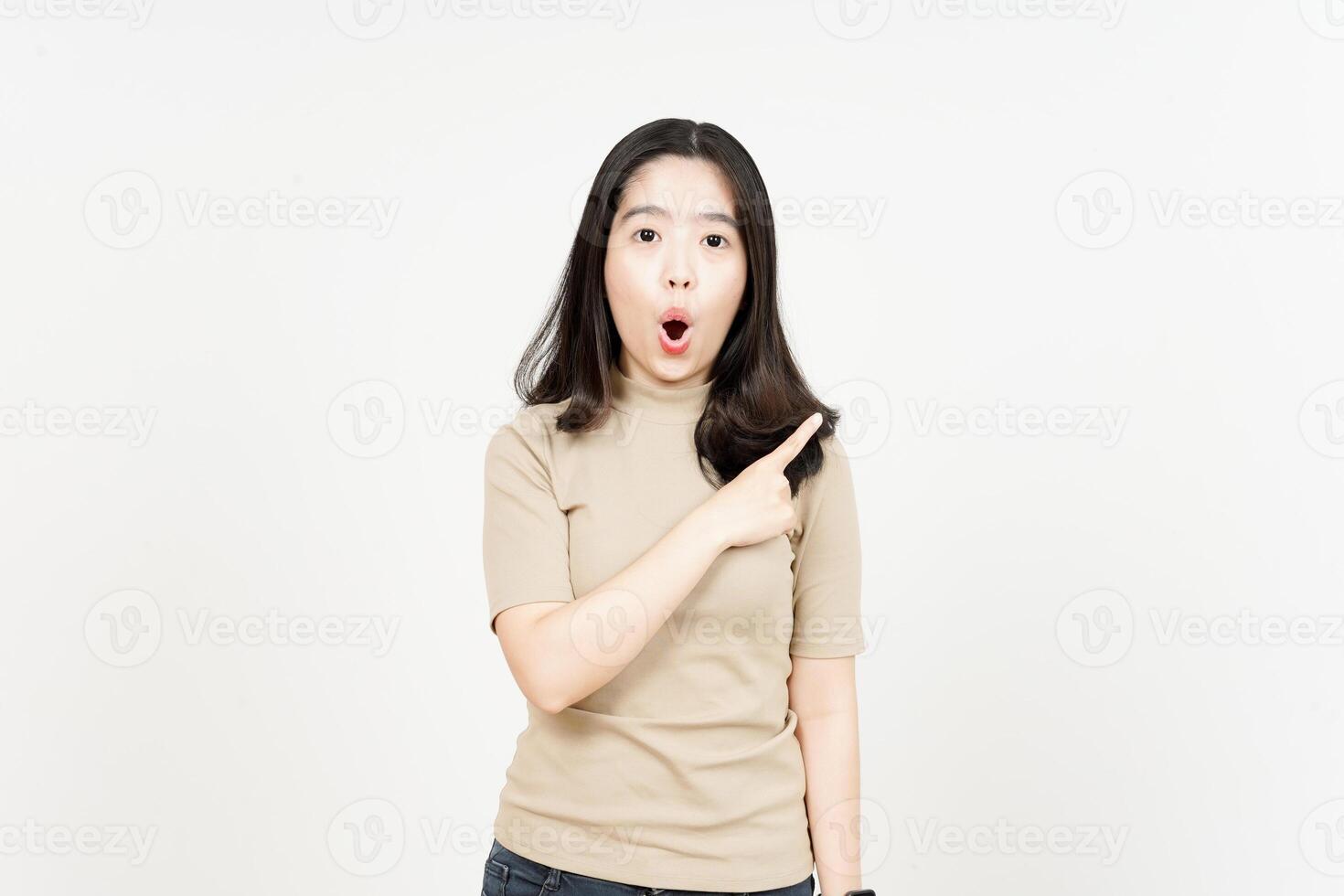 Showing Product and Pointing Side Of Beautiful Asian Woman Isolated On White Background photo