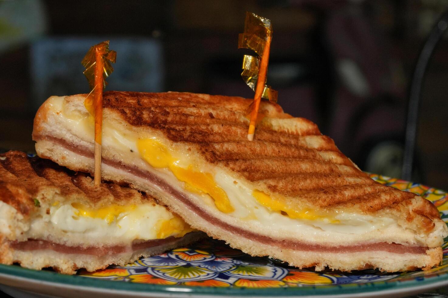 a sandwich with eggs and ham on a plate photo