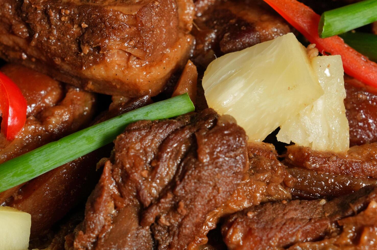a plate of meat and vegetables with pineapple photo