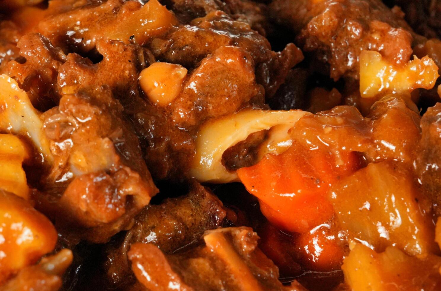 a close up of a dish of meat and vegetables photo