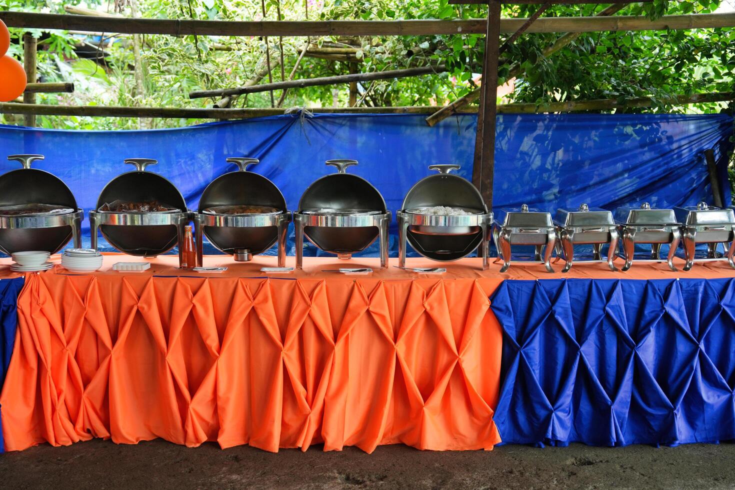 a table with a blue and orange cloth photo