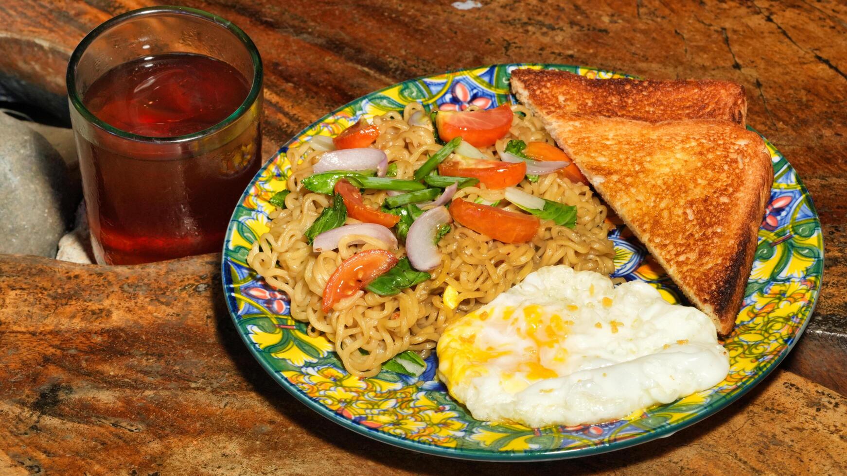pancit canton with egg and toasted bread photo