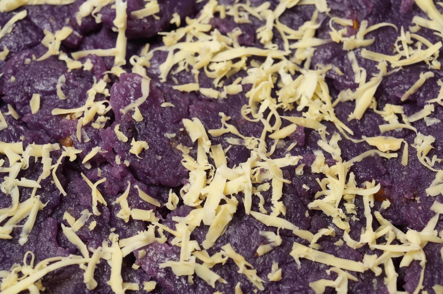 a close up of ube with cheese on top photo