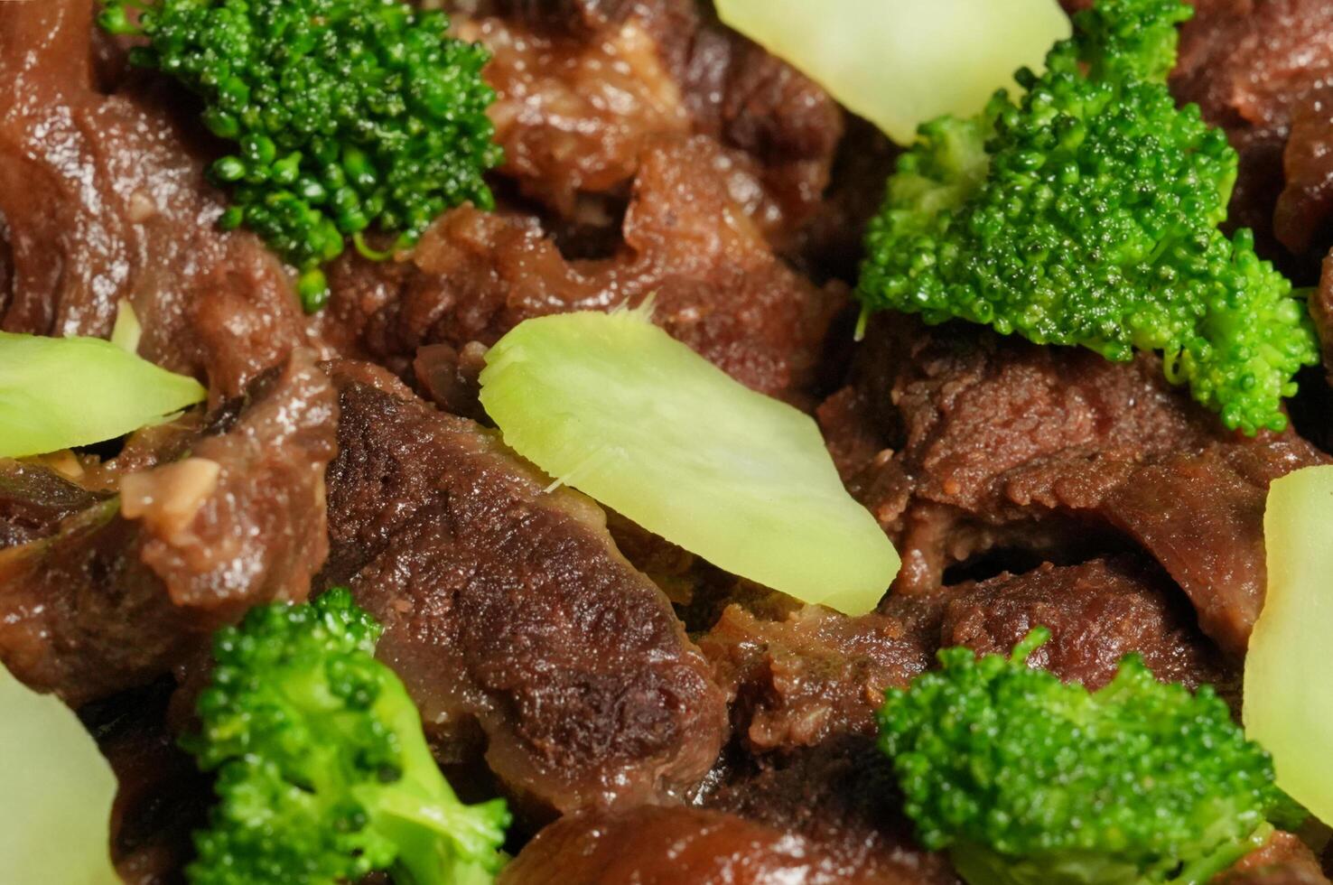 a close up of a plate of beef and broccoli photo