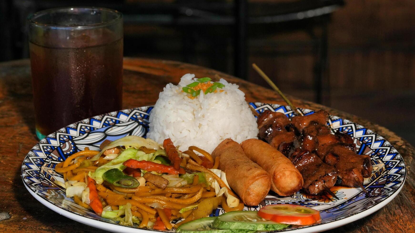 a plate of food with rice and meat on it photo