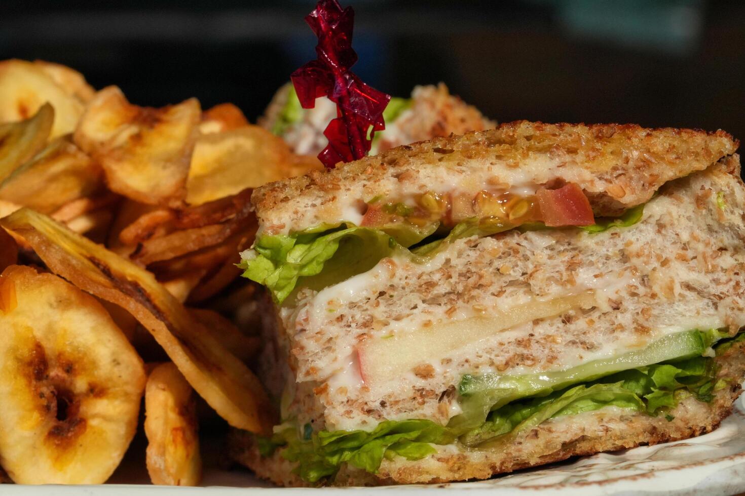 a sandwich with lettuce and cheese photo
