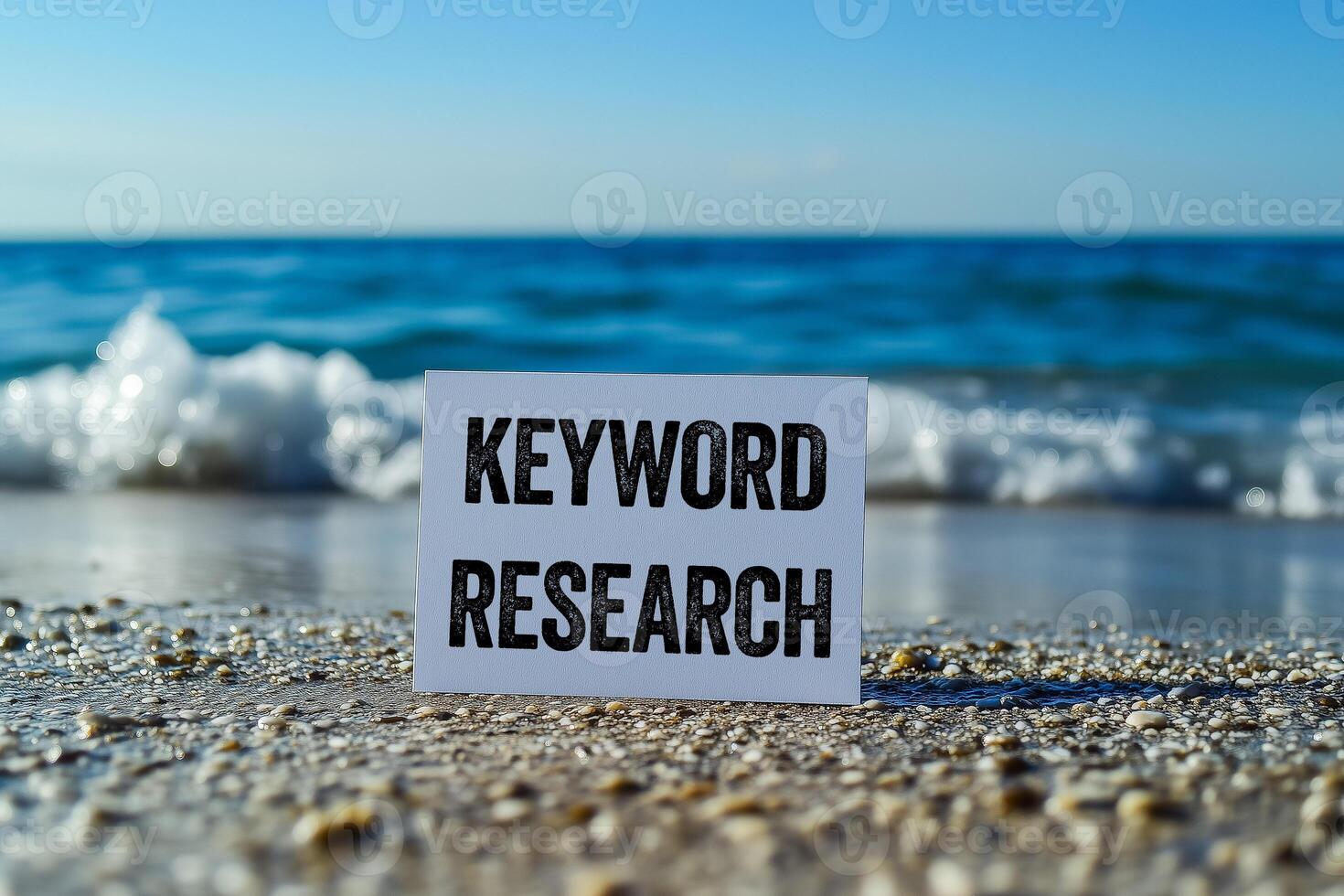 Keyword research message written on white card on sea background. Conceptual keyword research symbol. Copy space. photo