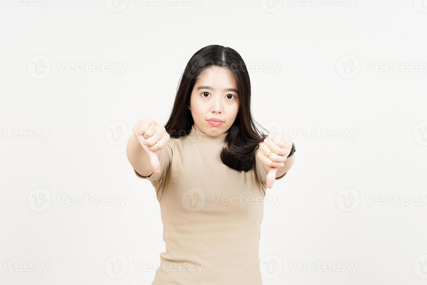 Showing Thumbs Down Of Beautiful Asian Woman Isolated On White Background photo