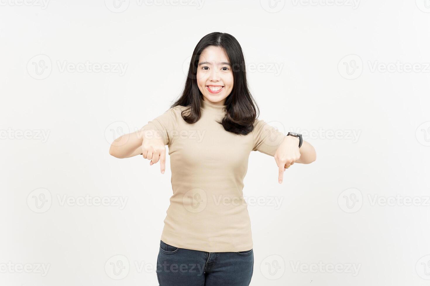 Pointing down and showing blank copy space Of Beautiful Asian Woman Isolated On White Background photo