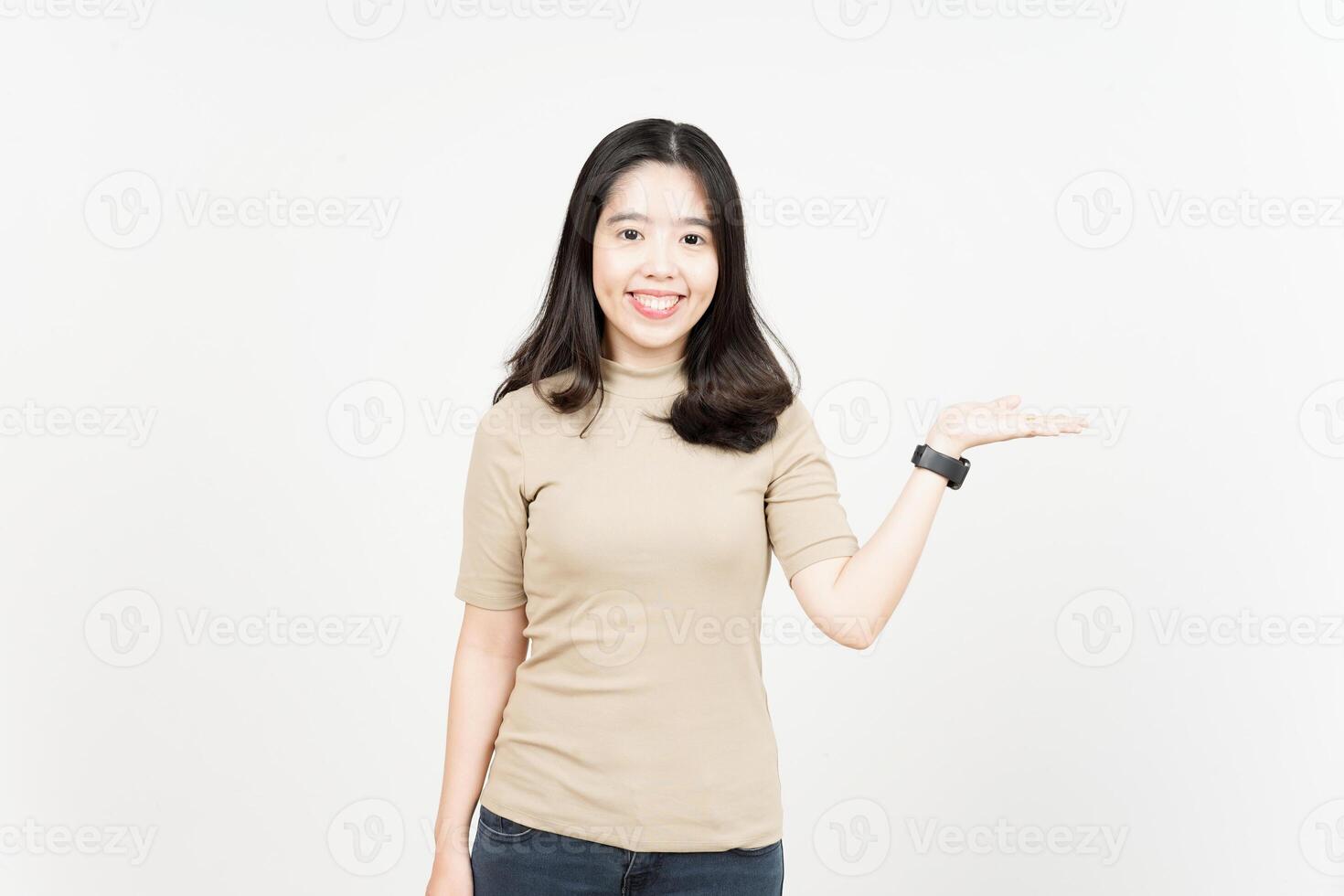 Showing and Presenting Product on Open Palm Of Beautiful Asian Woman Isolated On White Background photo