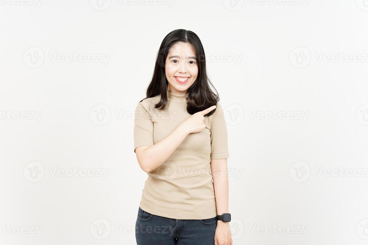 Showing Product and Pointing Side Of Beautiful Asian Woman Isolated On White Background photo