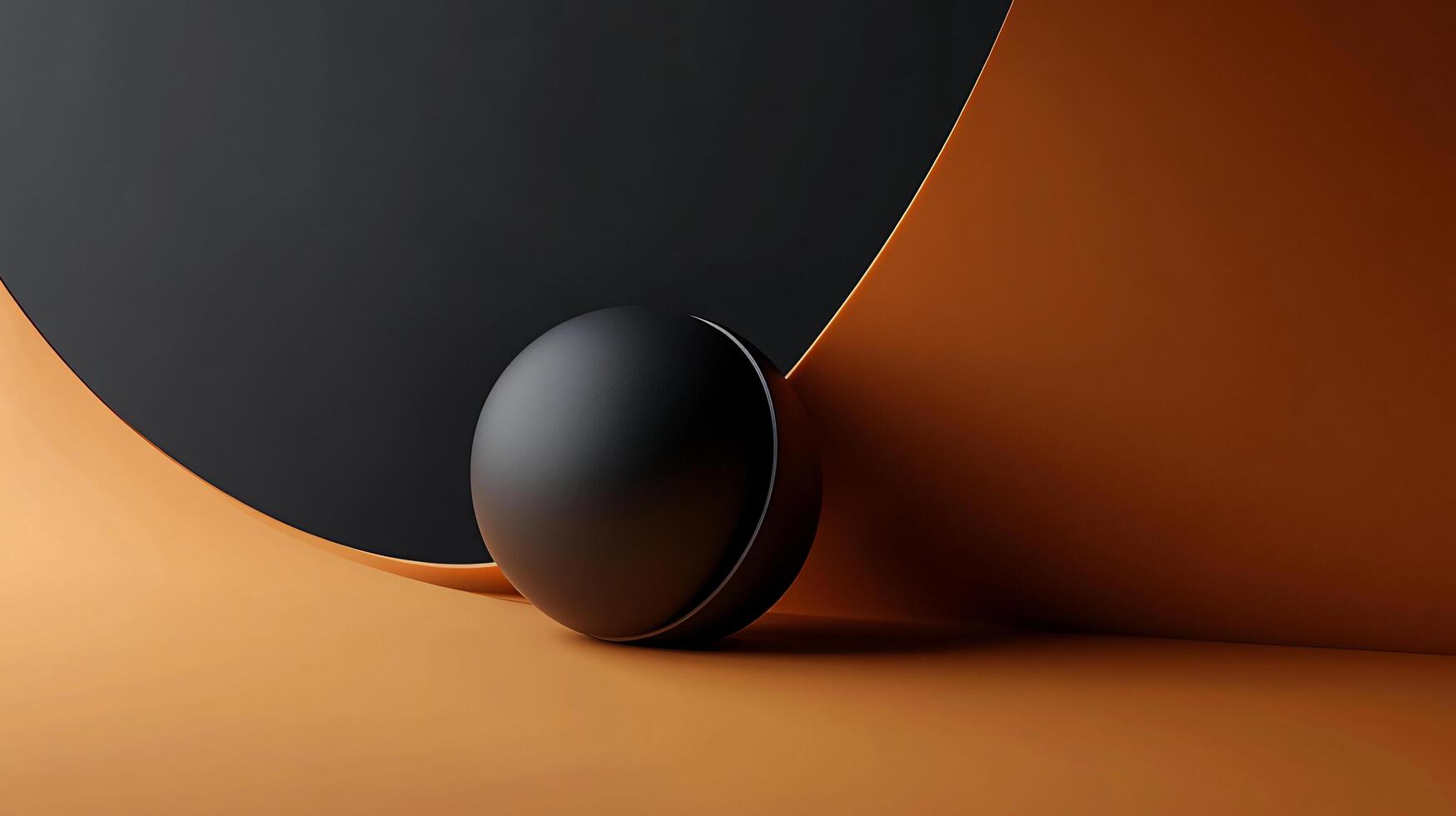 Black ball is on a curved surface. The ball is on a piece of paper that is orange photo