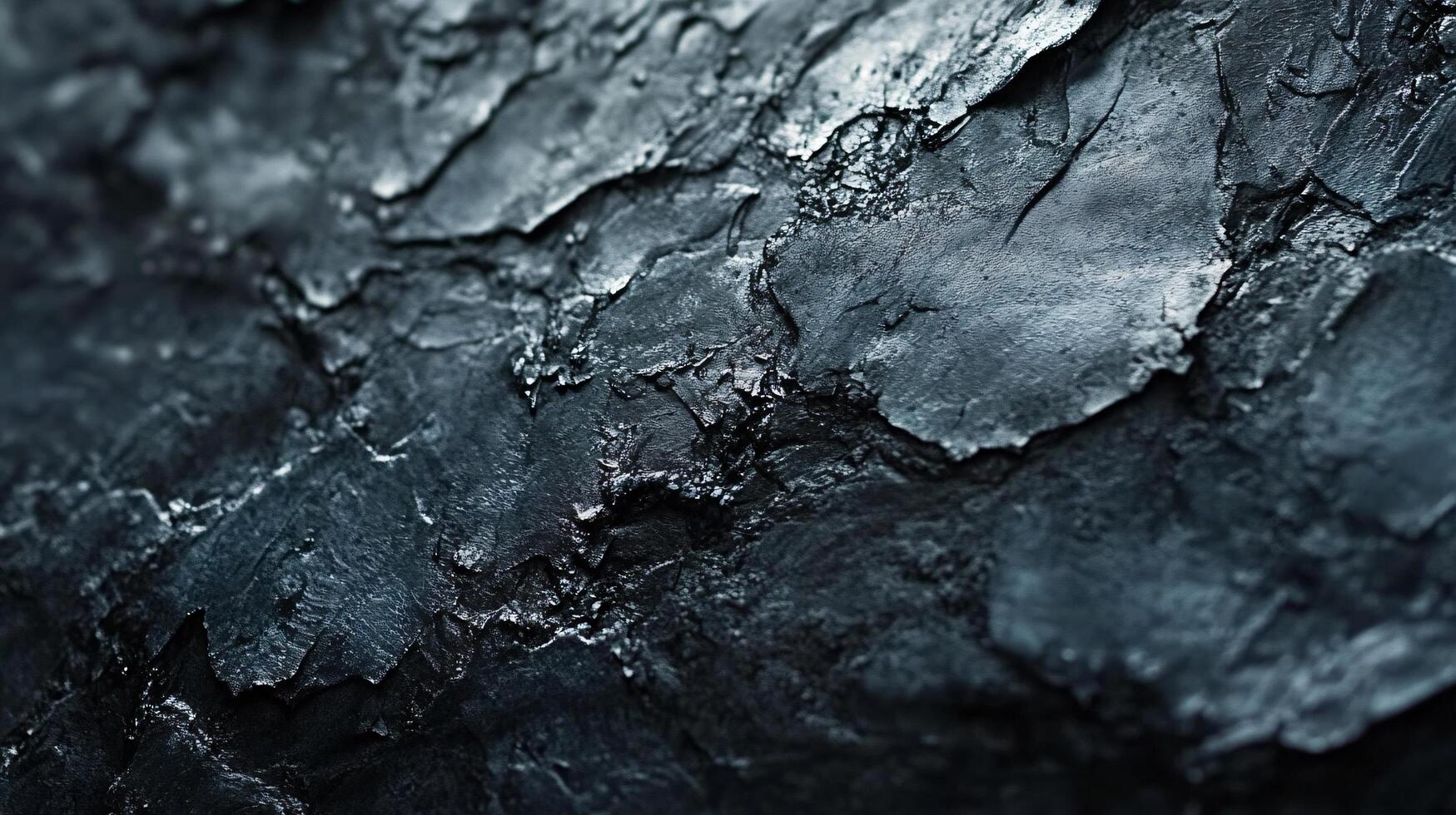 Close up of a rock with a dark blue color. The rock has a rough texture and he is weathered photo
