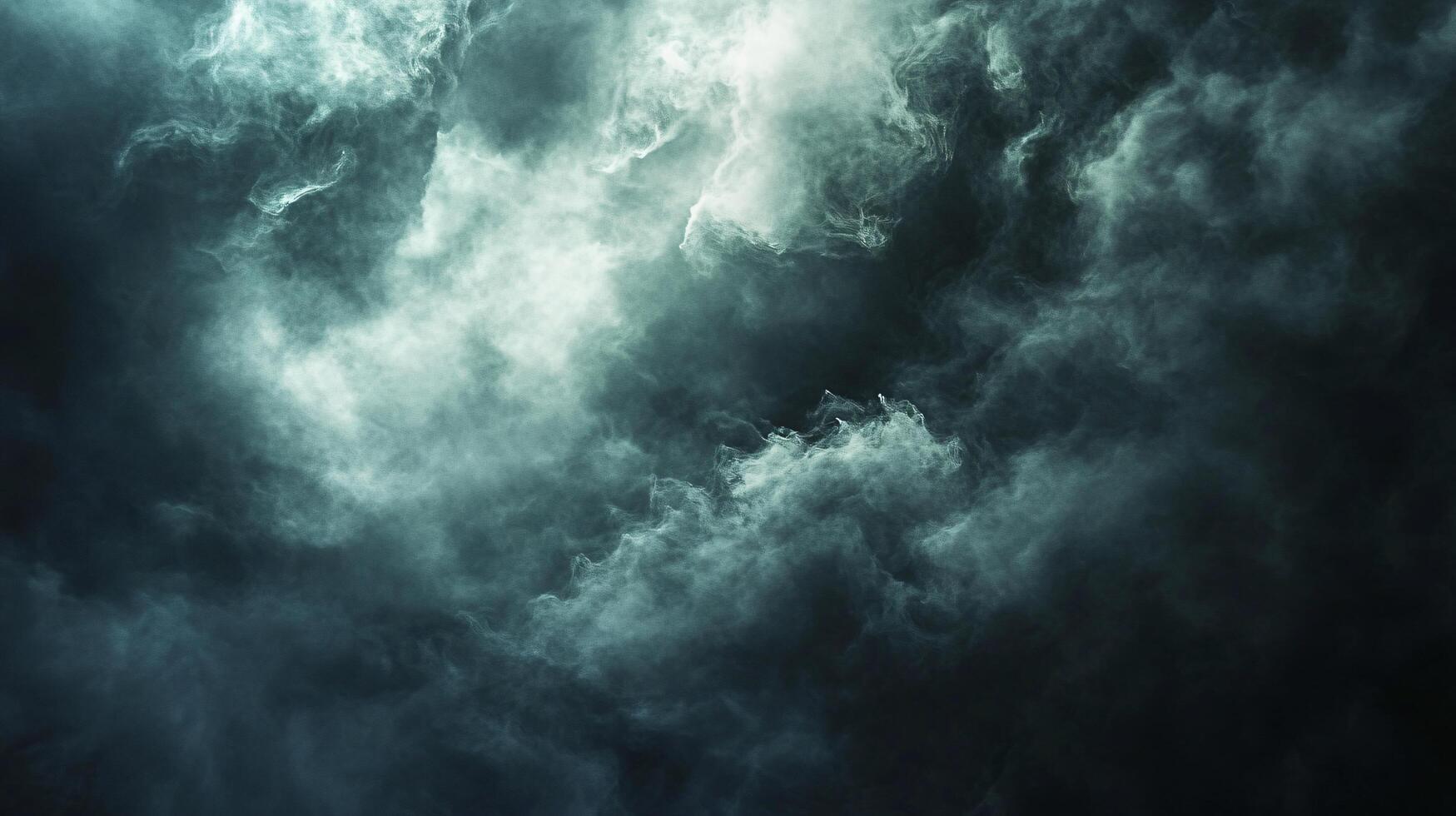 Dark sky with clouds and a sense of foreboding. The clouds are thick and heavy, and the sky is almost black. Scene is ominous and foreboding, as if something bad is about to happen photo