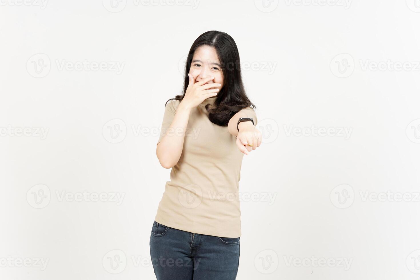 Pointing to you and Laughing Of Beautiful Asian Woman Isolated On White Background photo